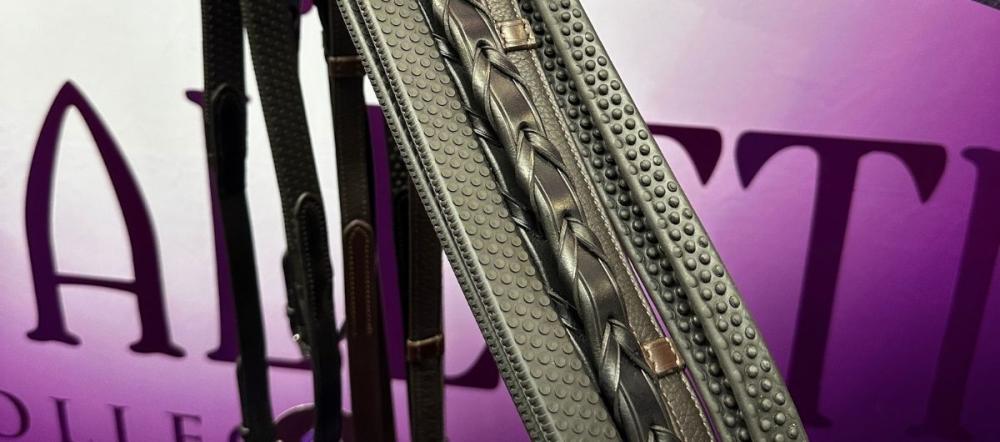 Close-up of Cavaletti Collection plaited leather reins and grip-textured stirrup leathers